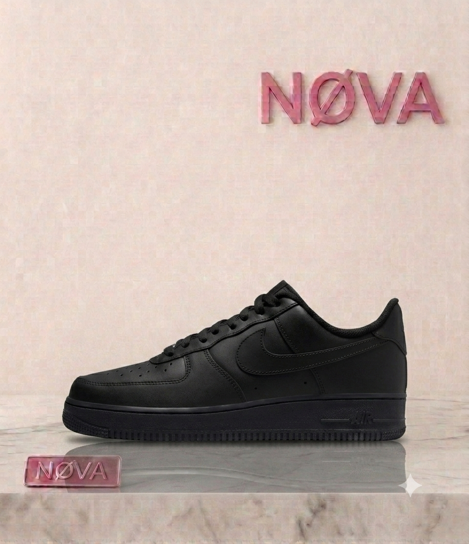Black Nike Air Force 1 sneakers with a smooth leather upper and flat rubber sole, showcased on a marble surface.