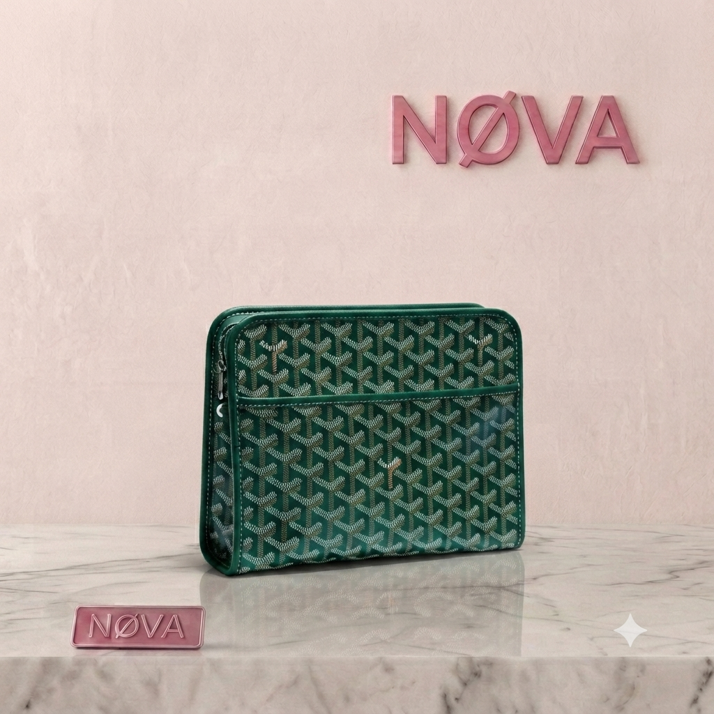 Goyard Jouvence Toiletry Bag in dark green with a geometric pattern and a zip closure, displayed on a marble surface.